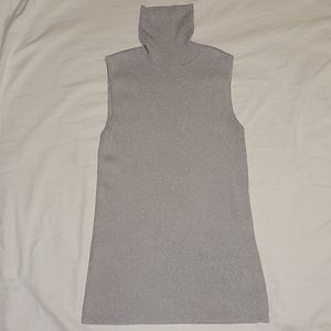 Large silver sparkly sleeveless turtleneck blouse